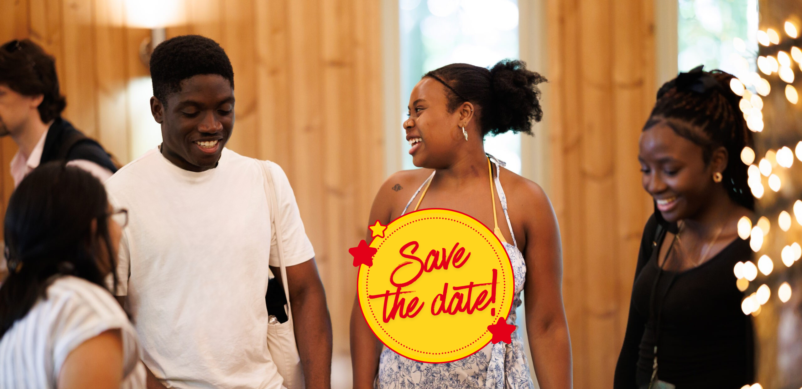 Four young adults smiling, with a circle overlaying the image which says "save the Date"